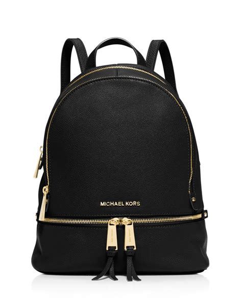 black backpack with gold zippers.